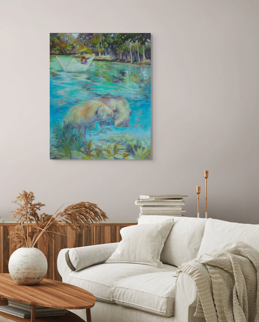 Original wildlife oil painting featuring manatees displayed in a modern living room interior, fine art painting inspired by nature and belonging, available original artwork by Martina Goulart.