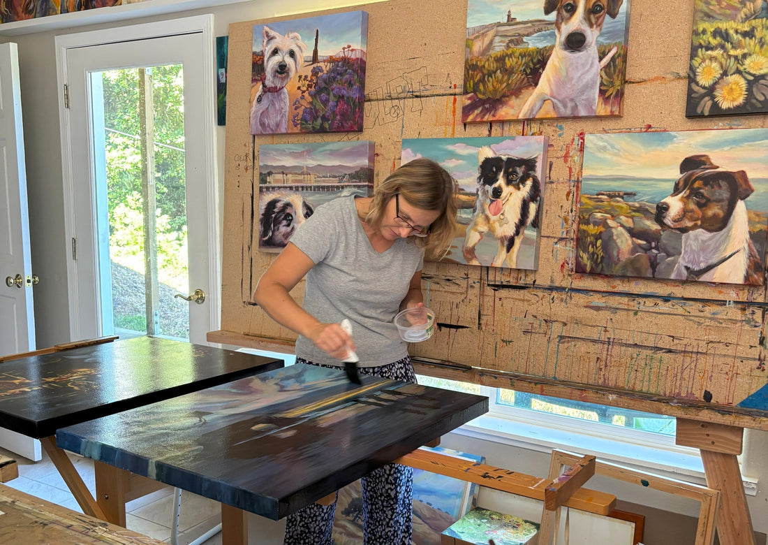 Artist working on a large original oil painting in studio, illustrating the time, materials, and craftsmanship behind fine art pricing.