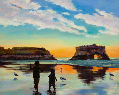 Oil painting of two children standing in wet sand at a Santa Cruz beach sunset with coastal cliffs and natural sea arch.