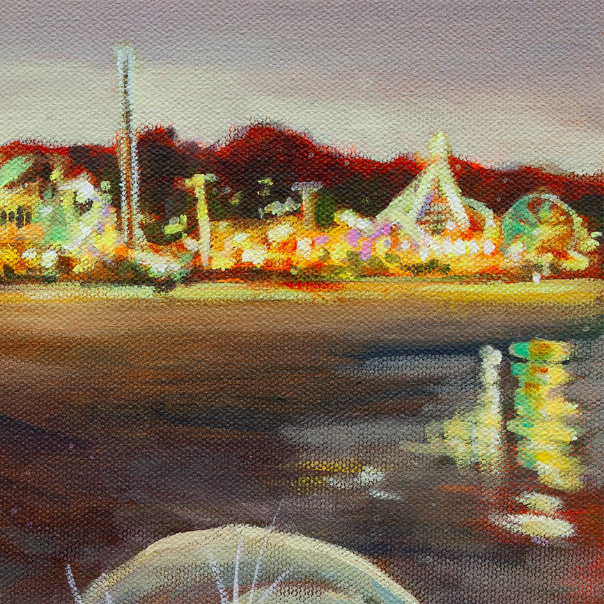 Bright, colorful lights of the Santa Cruz Beach Boardwalk at dusk, with reflections shimmering across the dark water.
