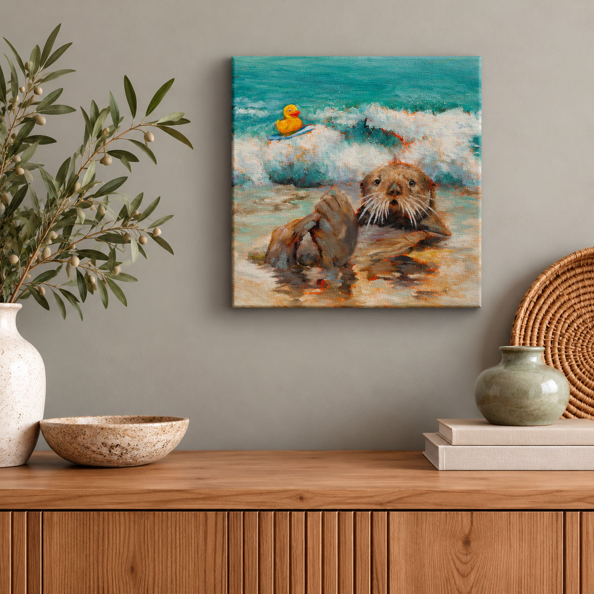 10x10 original sea otter painting by Martina Goulart, featuring a playful otter and yellow rubber duck in ocean waves, displayed above a wooden console in a cozy, modern interior.