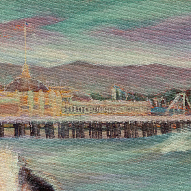 Close-up of the yellow Boardwalk building, ocean, and rollercoasters from the Santa Cruz coastal dog painting.