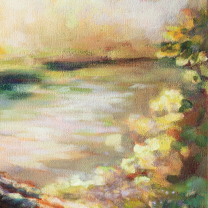 Detail of calm water reflecting light beside the girls.