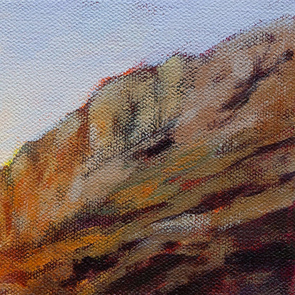 Detail of textured coastal rock face in warm evening light, oil painting.