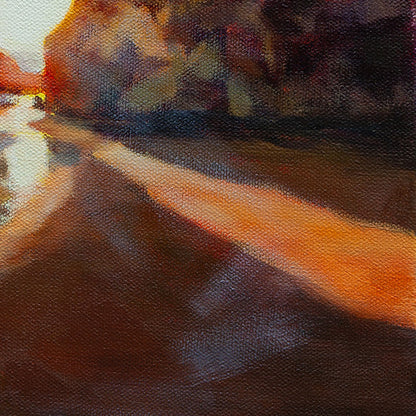 Detail of reflective wet sand and golden sunset light at the beach.