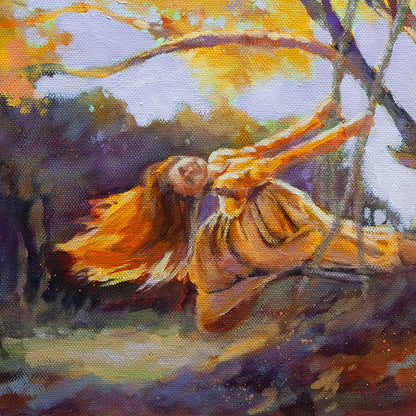 Detail of girl leaning back on a rope swing beneath sunlit tree branches.