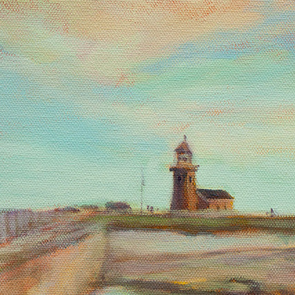 Close-up of the Santa Cruz lighthouse under a clear blue sky with soft yellow and orange clouds from the painting Ocean Scout by Martina Goulart.