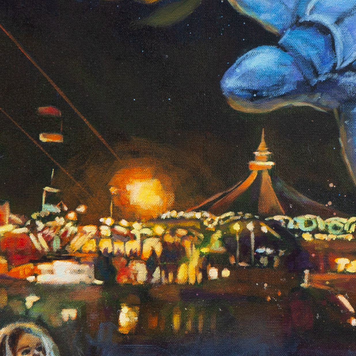 Close-up of a blue sea turtle’s head above glowing Boardwalk rides, bright carousel light, and red and yellow structures from Magical Santa Cruz.