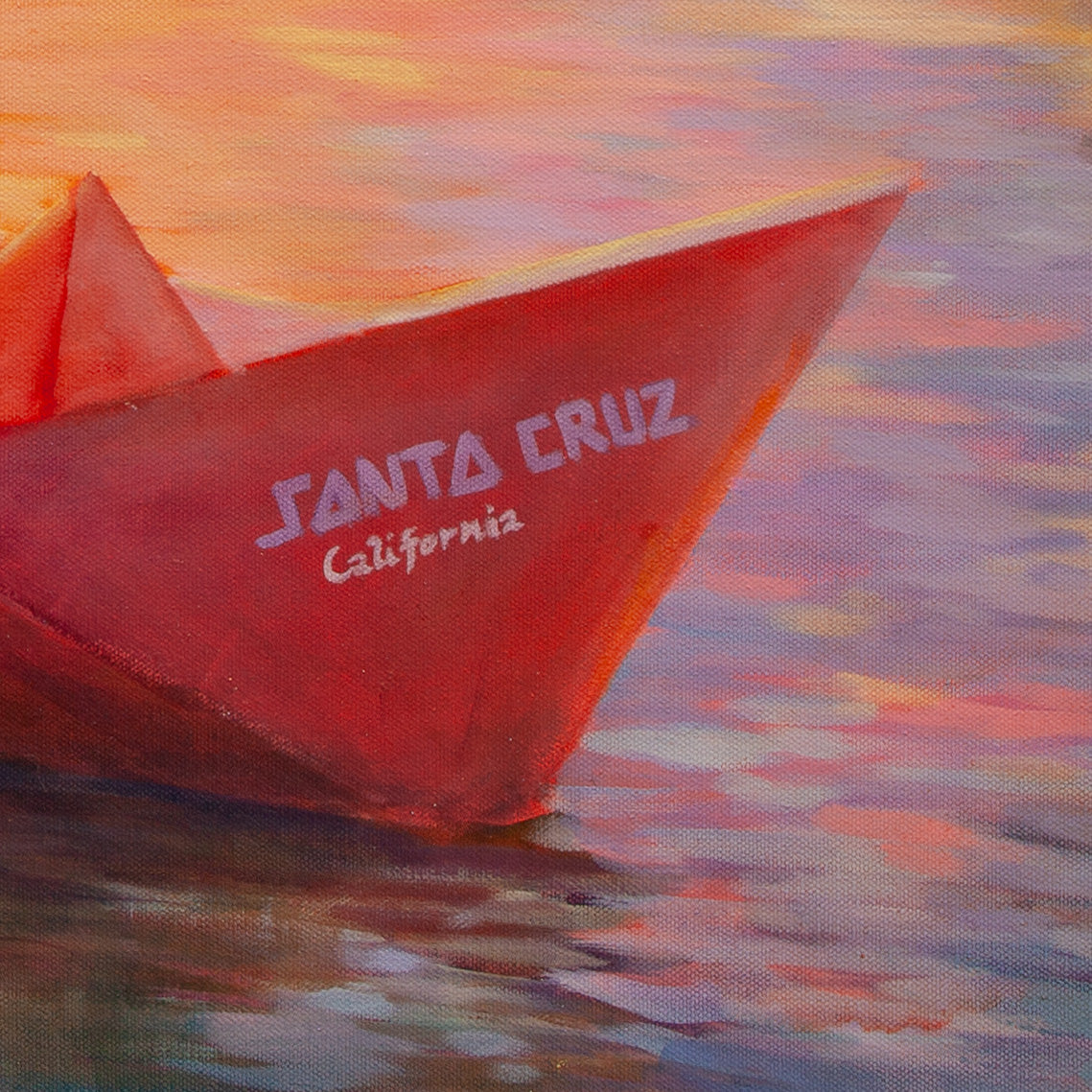 Detail of red paper boat with ‘Santa Cruz California’ written on side, surrounded by blue, pink, and purple brushstrokes from Safe Harbor.”