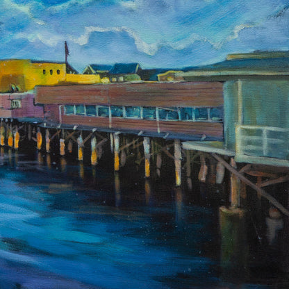 Detail of mint, pink, and yellow pier buildings on stilts above dark water, soft blue clouds overhead from Echoes of Monterey, coastal art.