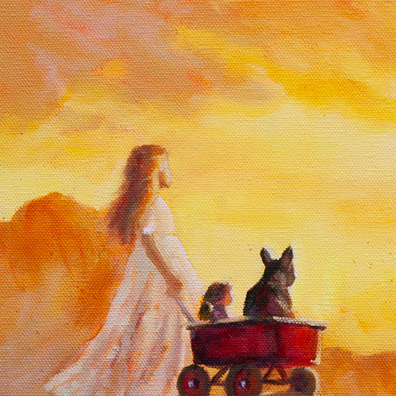 Close-up of a girl standing on a mountain at sunrise with a red wagon beside her. A small dog and a doll sit inside the wagon. Warm orange light from the sunrise glows behind them.