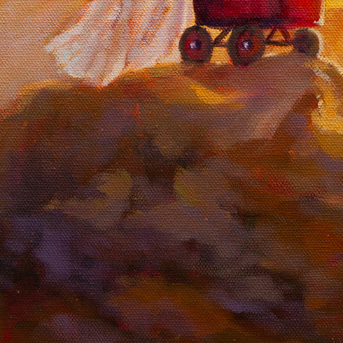 Close-up of the rocky mountain surface beneath the red wagon, showing wagon wheels and textured rocks painted in brown, gold-brown, and hints of purple.