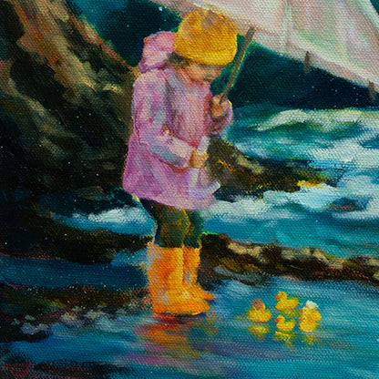 Close-up of a girl shielding small rubber ducks in a pool with a brown cliff and ocean water in the background.