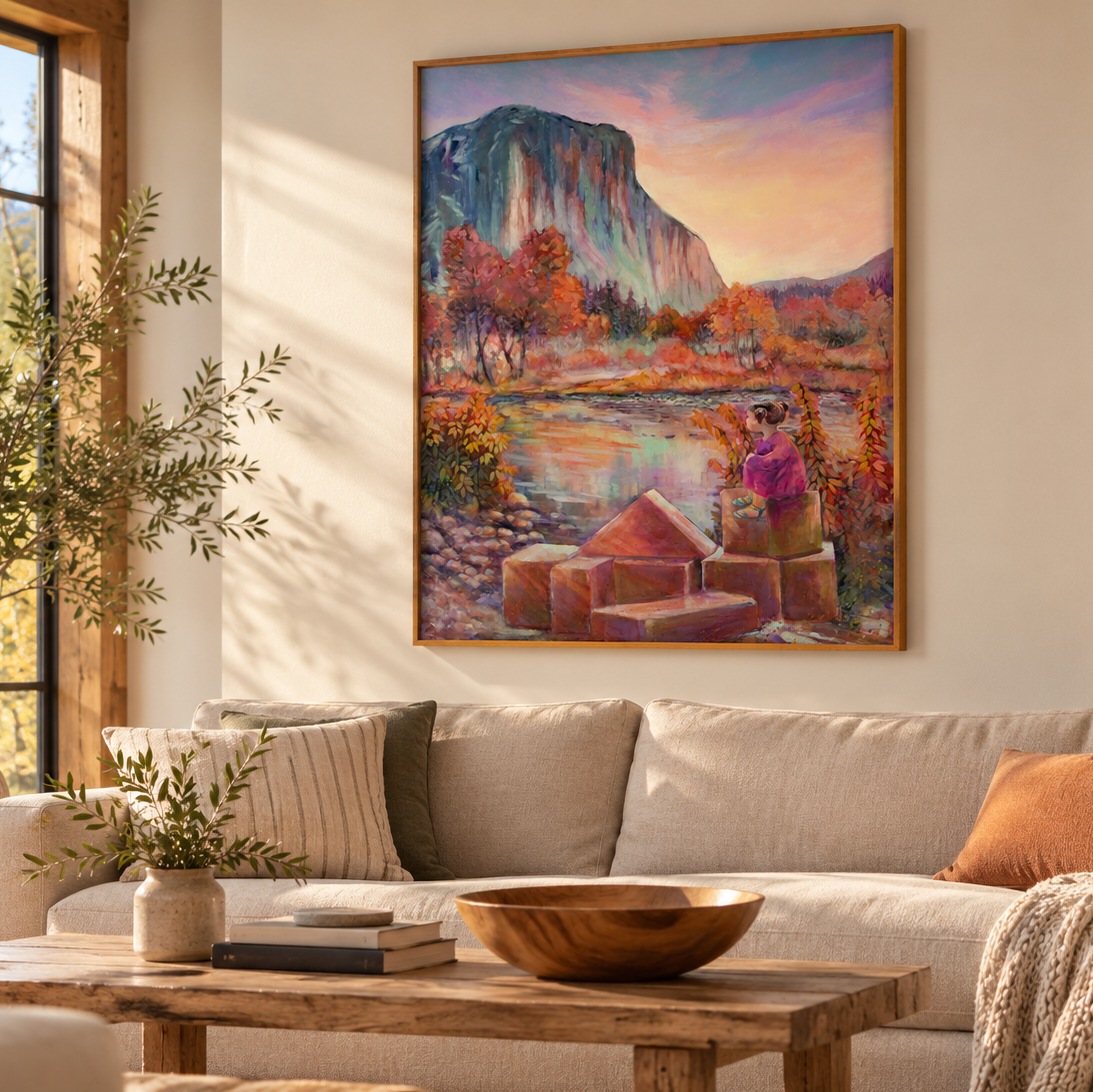 One Day El Cap art print by Martina Goulart, featuring a young girl overlooking a peaceful river beneath Yosemite’s El Capitan, surrounded by colorful autumn trees, displayed in a cozy living room with natural wood furniture and warm sunlight.