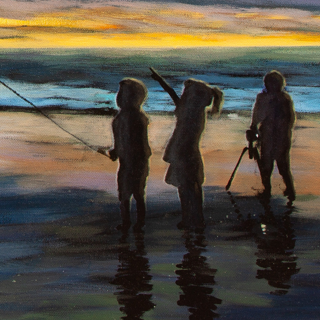 Close-up of silhouettes of two children and photographer with yellow-orange light, blue ocean waves, and glowing reflections from Threads of Light.