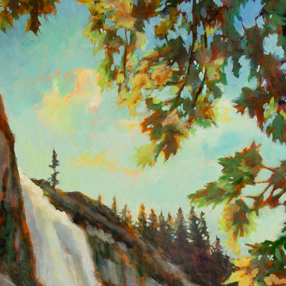 Detail of rushing white water at the top of Nevada Fall, tan rocks, evergreens, and blue sky with clouds from Trail of Wonder by Martina Goulart.