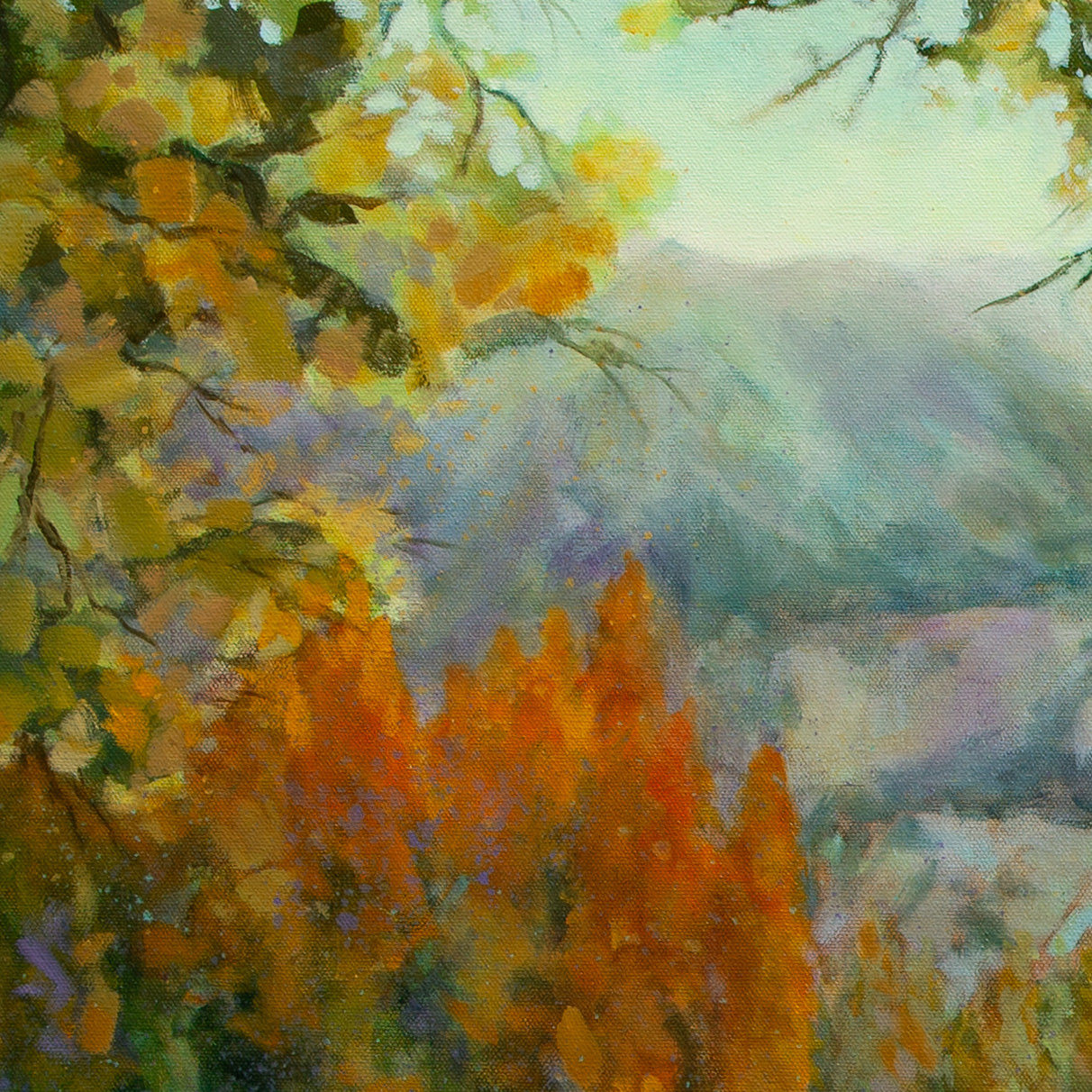 Close-up of yellow-green leaves and orange trees with soft blue-purple Yosemite mountains in background from Wearing the Wild, landscape art.