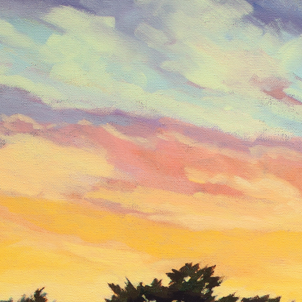 Close-up of glowing yellow, orange, and pink sunset sky with cool blue clouds from Where the Night Begins, ocean horizon painting.