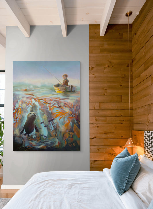 Large painting of a boy fishing above a kelp forest with a seal below, hanging on a bedroom wall beside warm wood paneling and soft lighting.