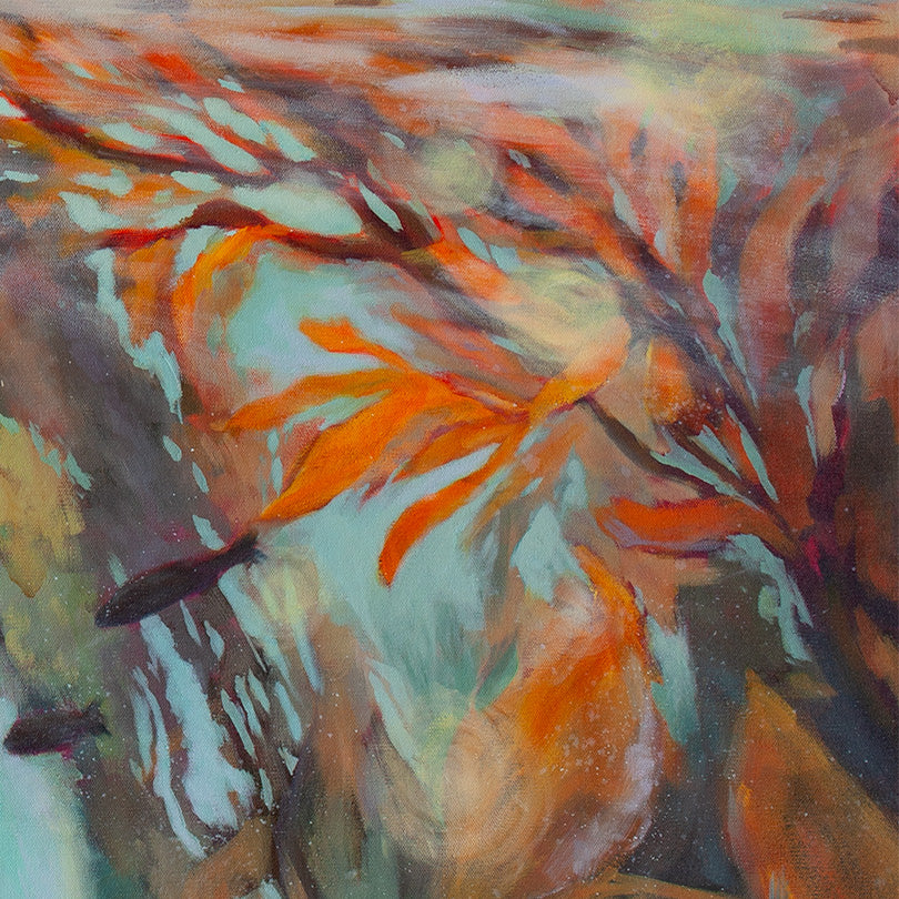 Close-up of orange and gold kelp leaves drifting underwater against soft teal and blue light.
