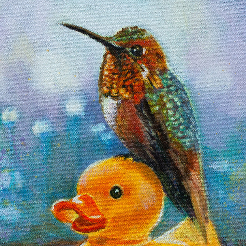 Close-up detail of an Allen’s hummingbird with orange throat and iridescent green feathers in morning light.