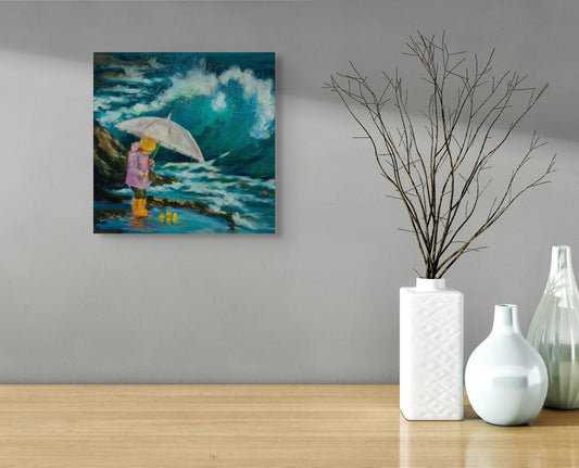 Painting of a child in a raincoat holding an umbrella beside a crashing ocean wave, hanging above a minimalist wooden surface with white vases.