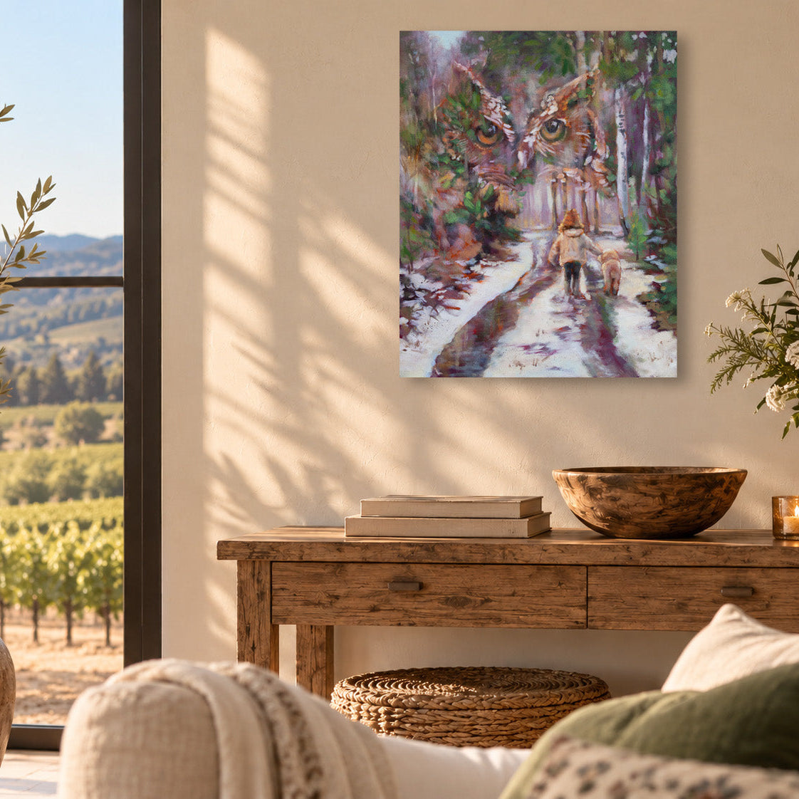 Whimsical woodland art print by Martina Goulart featuring a child and dog walking along a snowy forest path beneath the watchful eyes of a giant owl, displayed in a sunlit living room.