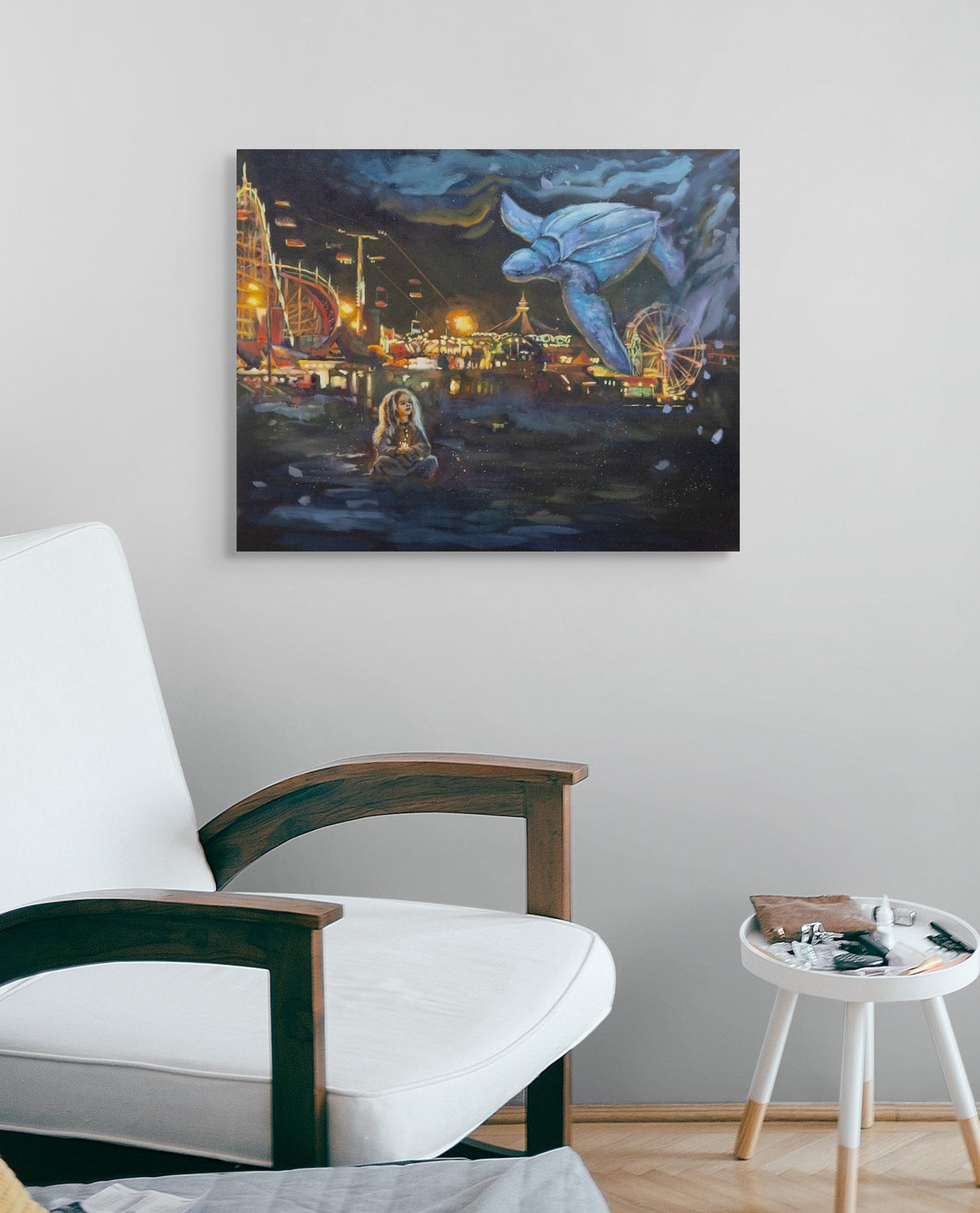 Original painting of a girl with a blue turtle above the Santa Cruz Beach Boardwalk, hanging over a white armchair, in glowing yellows, oranges, blues, and purples.