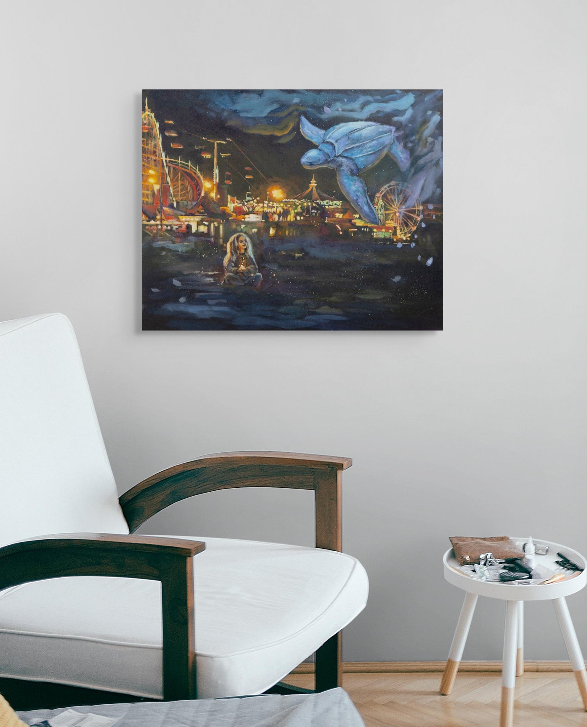 Original painting of a girl with a blue turtle above the Santa Cruz Beach Boardwalk, hanging over a white armchair, in glowing yellows, oranges, blues, and purples.