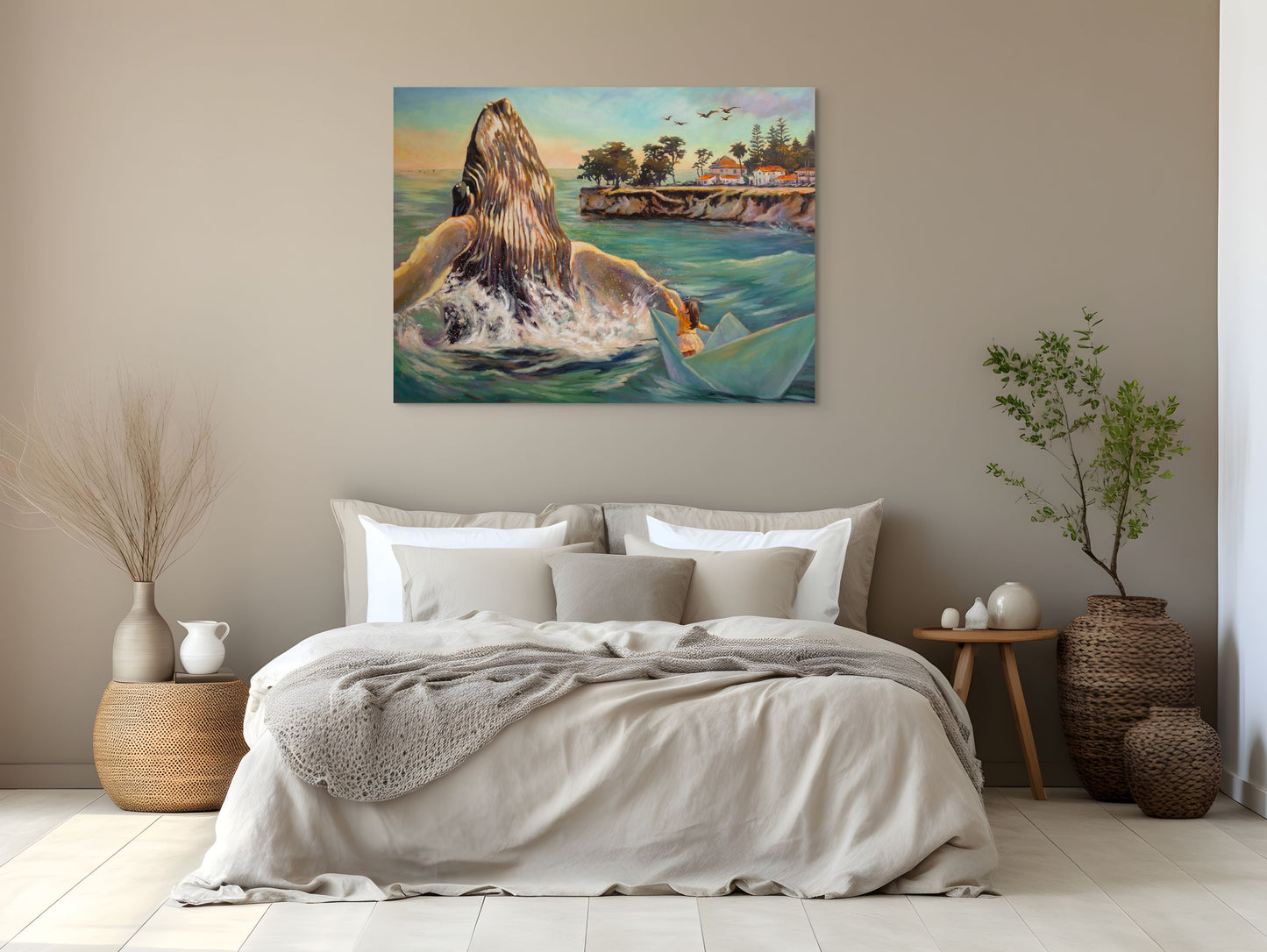 Modern neutral bedroom with the painting Within Reach hanging above the bed, showing a girl in a paper boat reaching toward a breaching whale along the Santa Cruz coast.