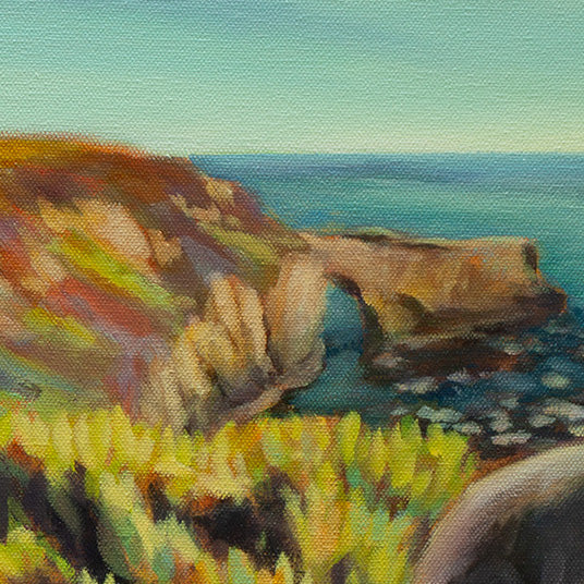 Detail of the coastal cliff arch, ocean, and plants in the foreground from Picture Perfect, a Santa Cruz coastal dog painting.