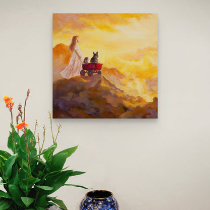 Painting of a girl pulling a red wagon with two animals at sunrise, hanging above a wooden table with a blue ceramic vase and greenery.