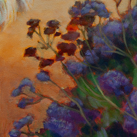 Close-up of red and purple flowers against sunlit yellow-orange sand walkway from Surfer’s Best Friend by Martina Goulart.