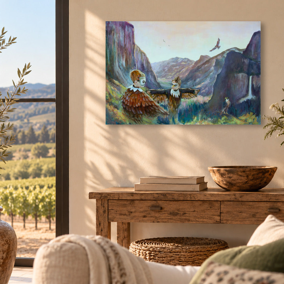 The Ones Who Came to Fly art print by Martina Goulart, featuring imaginative bird-like characters overlooking Yosemite Valley, displayed in a cozy living room with natural wood furniture.