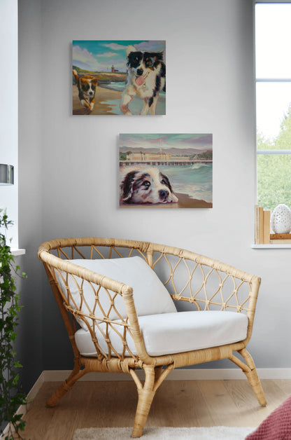 Room interior with a white chair and two original dog paintings from the Santa Cruz Boardwalk series hanging on the wall, art by Martina Goulart.