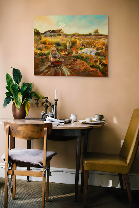 Painting Working Hard hanging on a brown wall above wood table with two chairs, houseplant, plate, cup, and newspaper in a warm, rustic room.